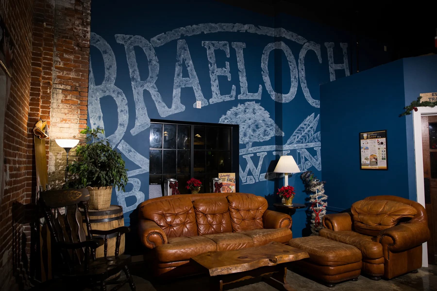 Leather couches under the hand-painted Braeloch mural